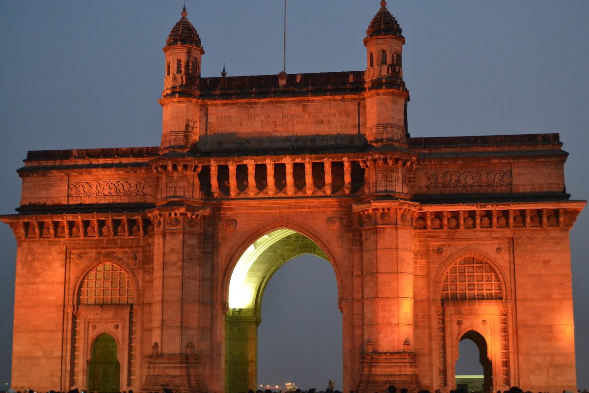 The Gateway of India lit at dusk in Mumbai, India